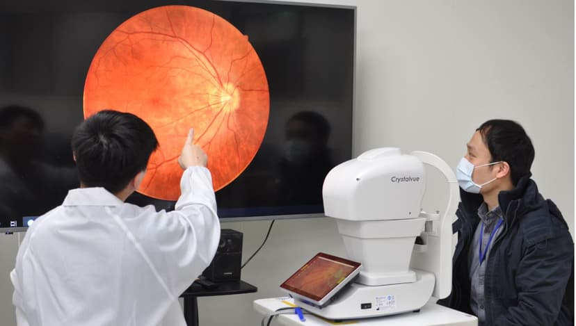 Digital retinal photography equipment in use during an eye test at Peter Collins Eyecare